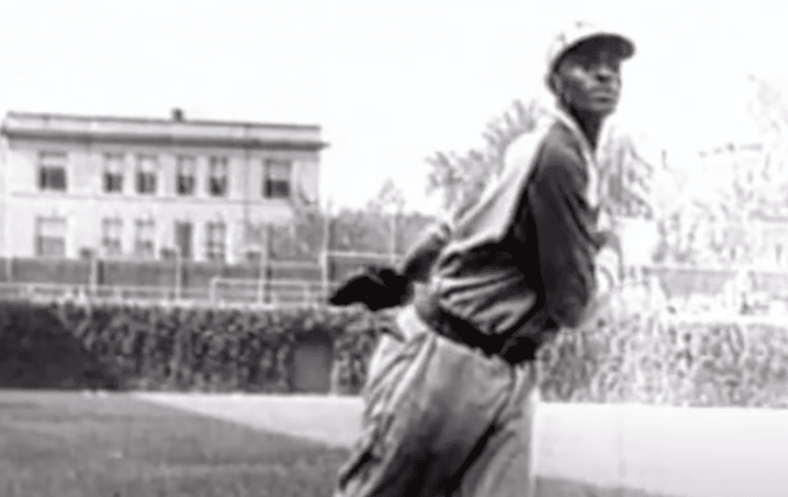 Satchel Paige pitching in his 40s, showcasing ageless talent in baseball.